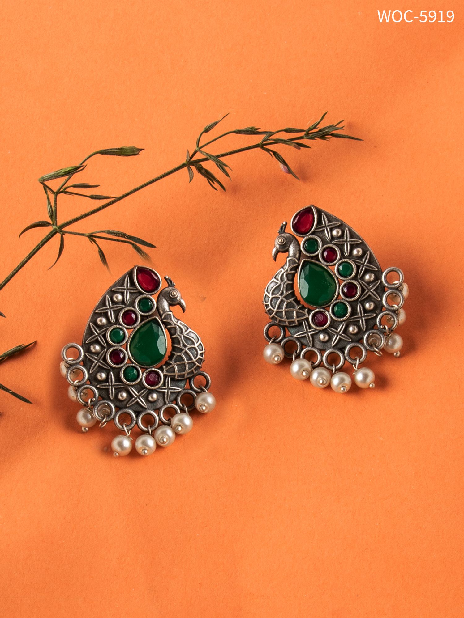 Silver lookalike peacock stone studd earrings